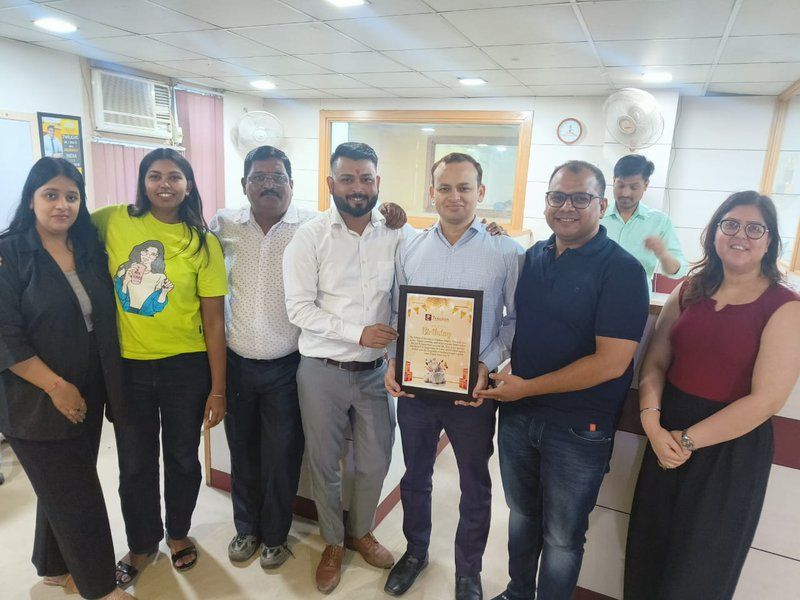 Trackon employee receiving a certificate of appreciation
