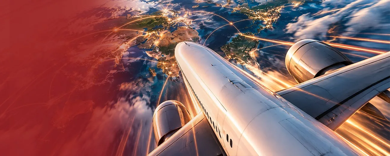 Aeroplane flying over a lit world map for Trackon international shipping